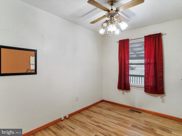 empty room with light hardwood / wood-style flooring and ceiling fan