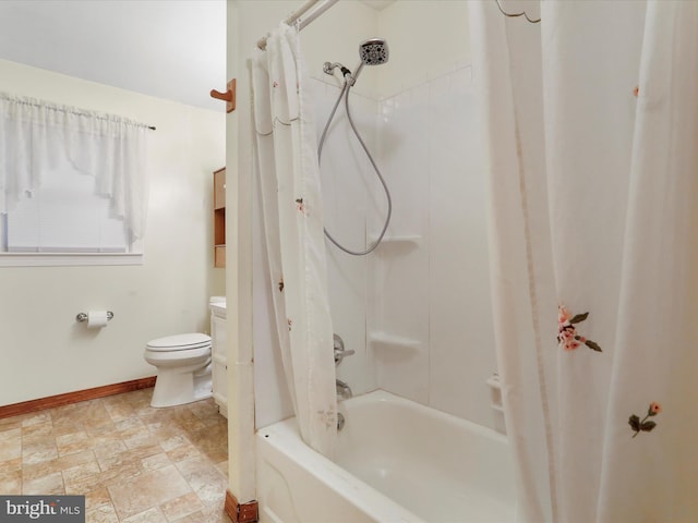 bathroom with toilet and shower / bath combo with shower curtain