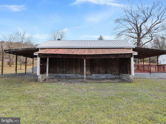 view of outdoor structure featuring a lawn