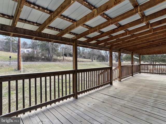 wooden deck with a lawn