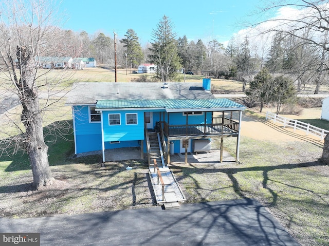 exterior space with a front yard and a deck