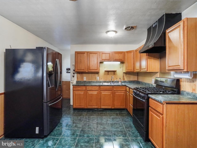 kitchen with ventilation hood, sink, black range with gas stovetop, stainless steel fridge with ice dispenser, and a textured ceiling