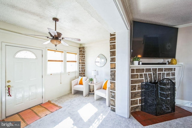 carpeted entrance foyer featuring ceiling fan and a textured ceiling