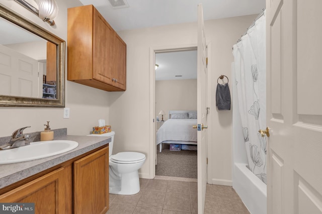 full bathroom featuring shower / bath combination with curtain, tile patterned floors, toilet, and vanity