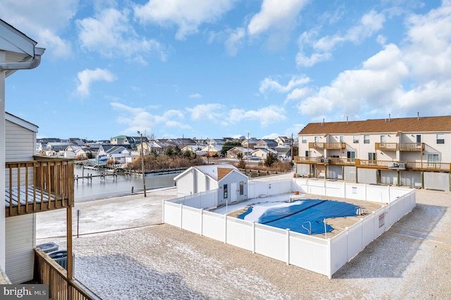 view of swimming pool with a water view