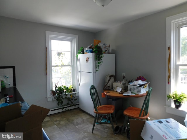 dining area with a baseboard heating unit