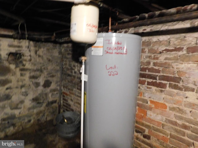 utility room with gas water heater