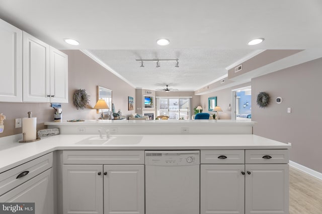 kitchen featuring sink, white cabinetry, crown molding, a textured ceiling, and dishwasher