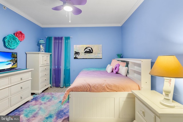 bedroom with crown molding, ceiling fan, and light wood-type flooring