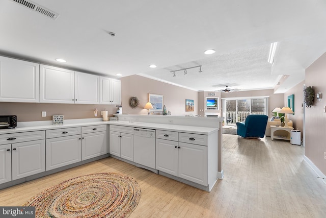 kitchen featuring dishwasher, light hardwood / wood-style floors, kitchen peninsula, and white cabinets