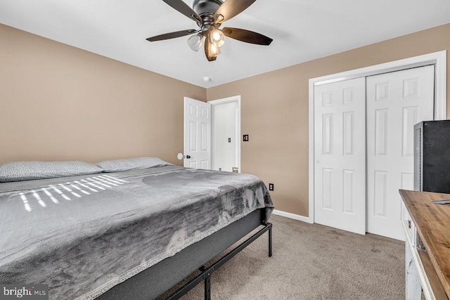 bedroom featuring a closet, ceiling fan, and carpet