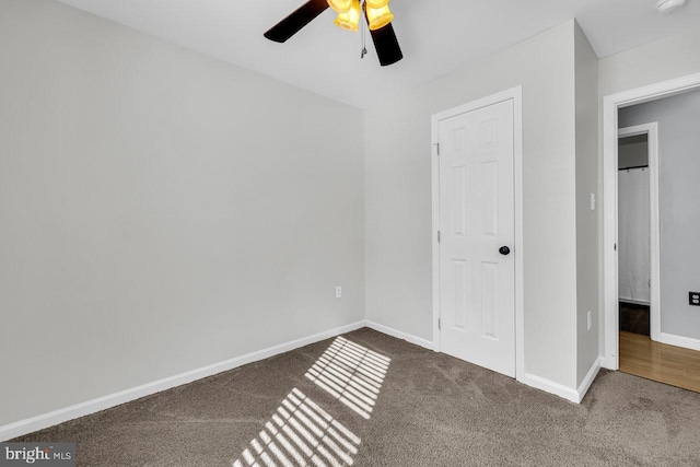 unfurnished bedroom featuring ceiling fan and carpet