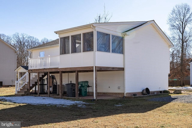 rear view of property featuring cooling unit, a wooden deck, and a sunroom