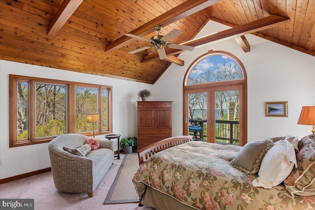 carpeted bedroom with beamed ceiling, wooden ceiling, multiple windows, and access to exterior