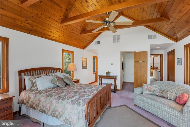carpeted bedroom with beamed ceiling and visible vents