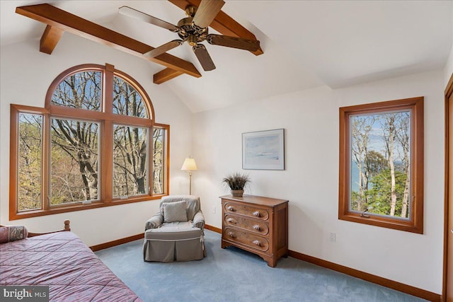 carpeted bedroom featuring baseboards, vaulted ceiling with beams, and ceiling fan