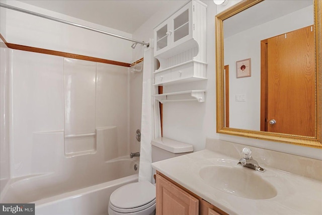 full bathroom featuring vanity, bathtub / shower combination, and toilet