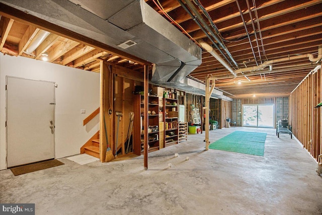 below grade area featuring visible vents and stairs