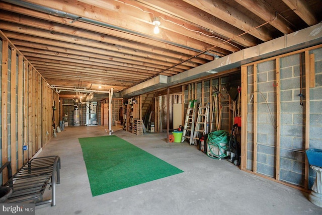 unfinished basement featuring heating unit