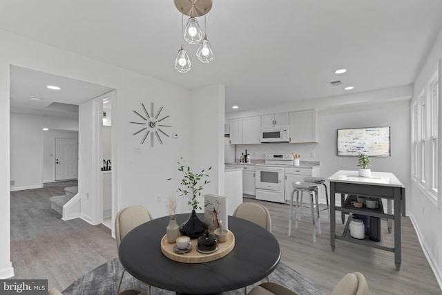 dining room featuring light hardwood / wood-style flooring