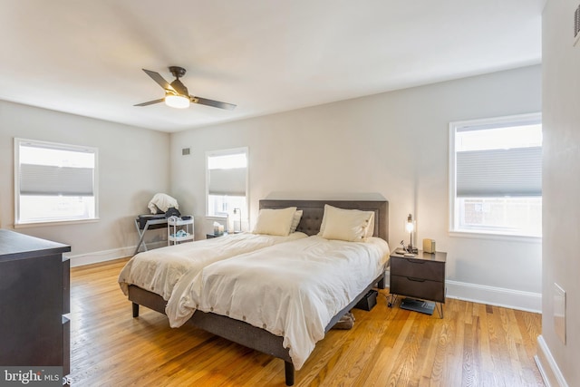 bedroom featuring ceiling fan and light hardwood / wood-style flooring