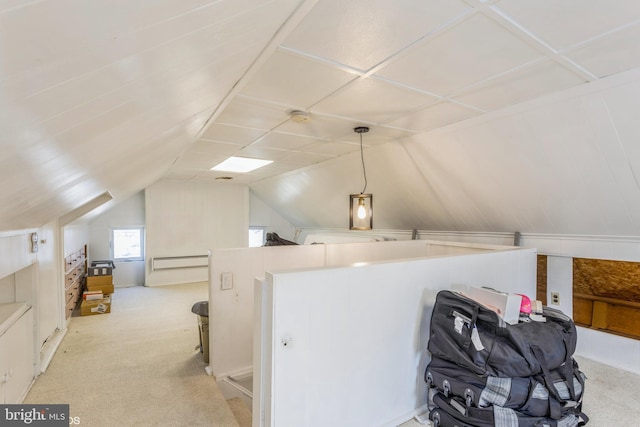 bonus room featuring vaulted ceiling and light colored carpet