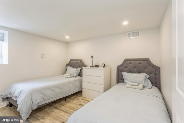 bedroom featuring light hardwood / wood-style floors