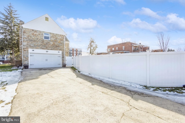 view of property exterior with a garage