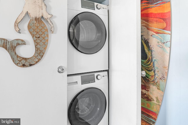 laundry area featuring stacked washer and clothes dryer