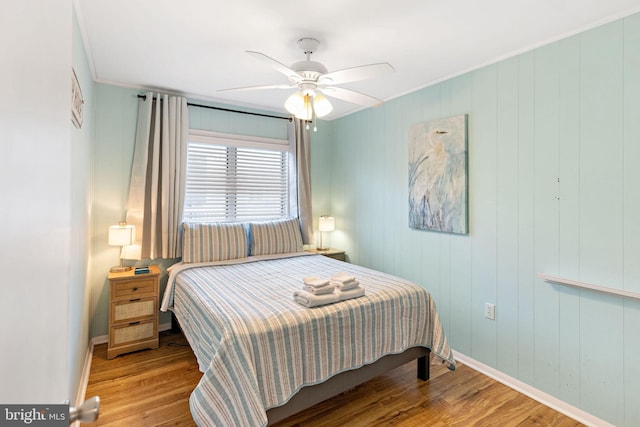 bedroom featuring ceiling fan and light hardwood / wood-style floors