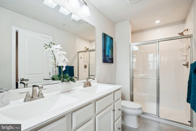 bathroom featuring walk in shower, tile patterned floors, and toilet