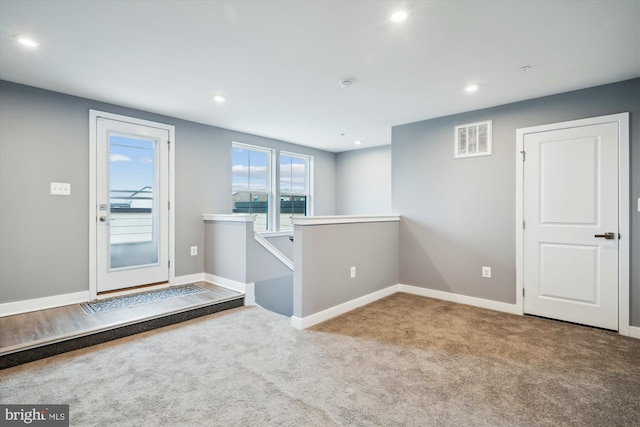 view of carpeted entrance foyer