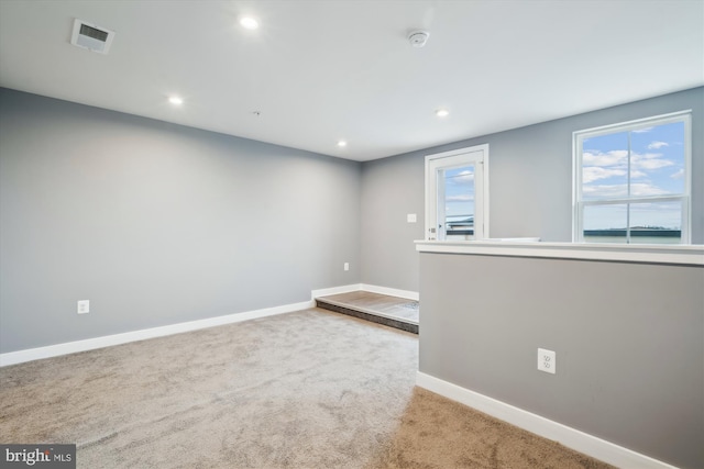 unfurnished room featuring carpet flooring