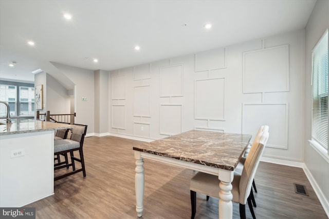 dining space featuring hardwood / wood-style floors