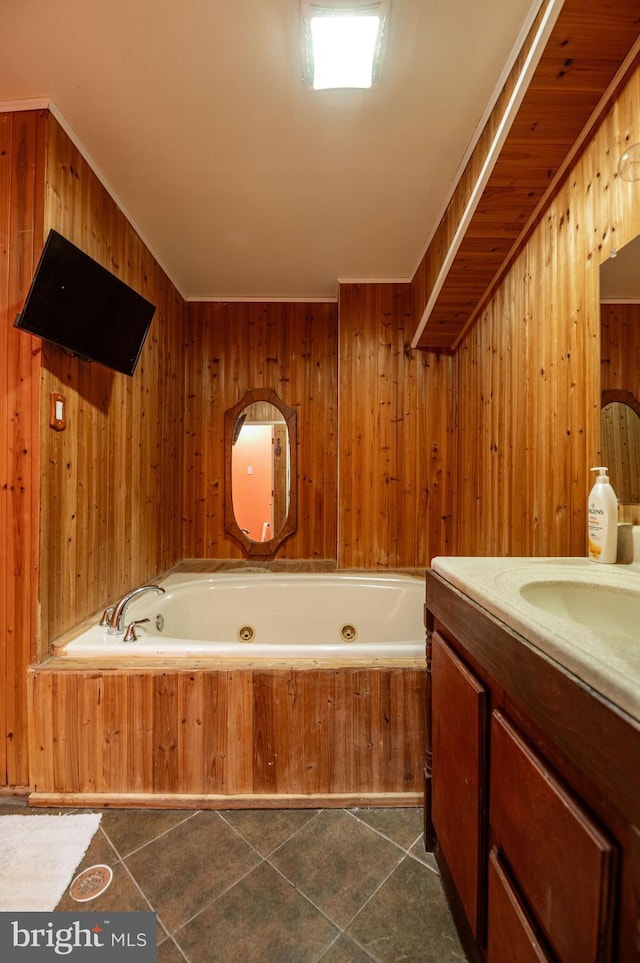 bathroom with tile patterned floors, vanity, a bath, and wood walls