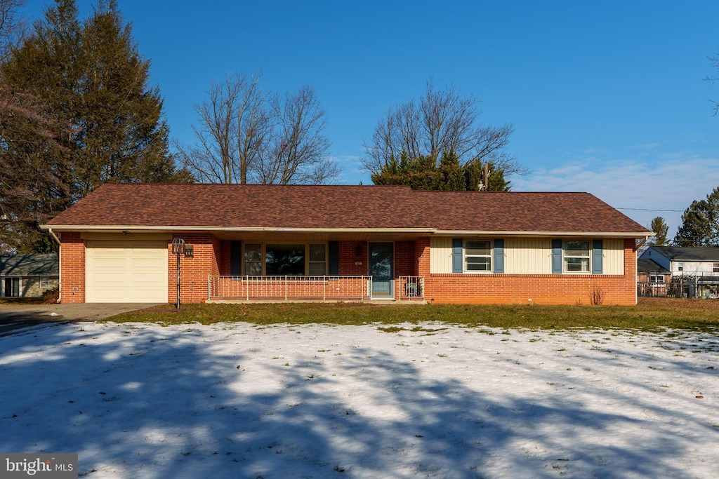 ranch-style house featuring a garage