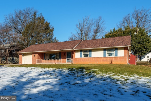 ranch-style home with a garage and a yard