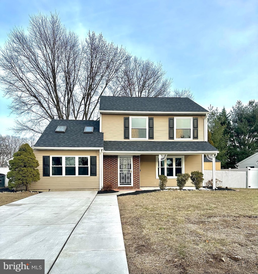 view of property featuring a front yard