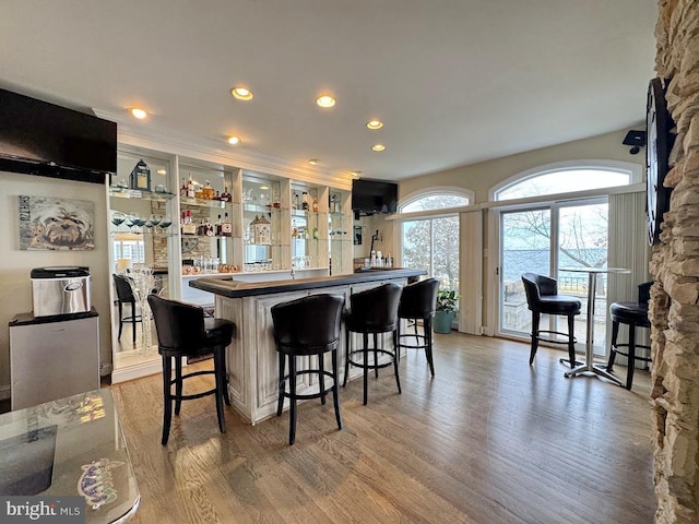 bar with hardwood / wood-style flooring