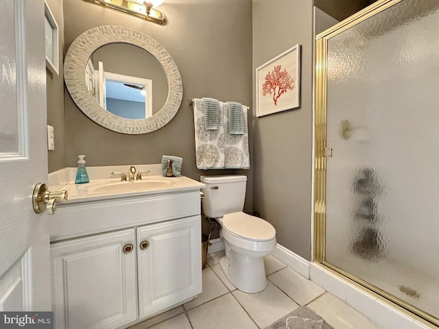 bathroom with tile patterned flooring, vanity, and a shower with shower door