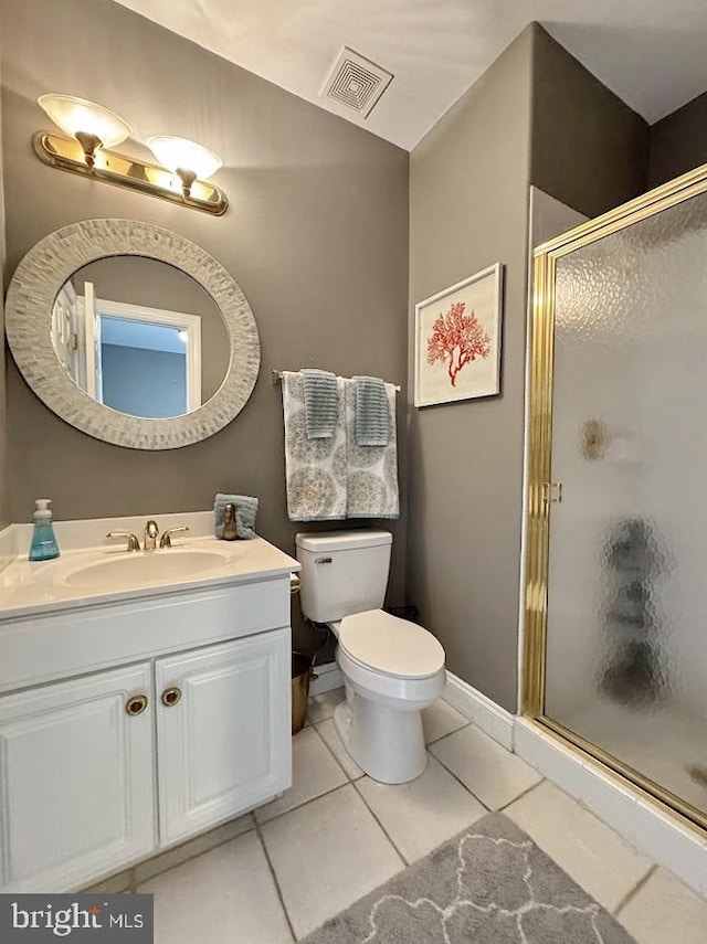 bathroom with vanity, an enclosed shower, tile patterned floors, and toilet