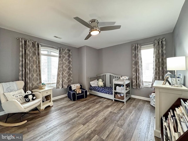 bedroom featuring wood-type flooring and ceiling fan