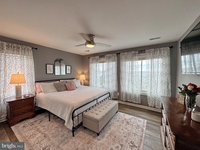 bedroom featuring wood-type flooring and ceiling fan