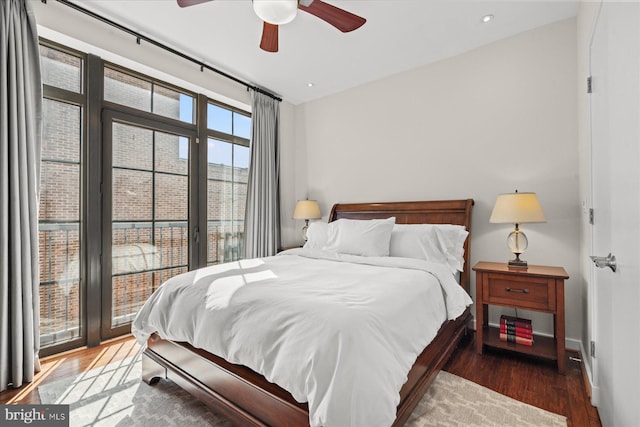 bedroom with a ceiling fan, recessed lighting, wood finished floors, and baseboards