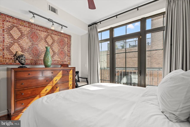 bedroom featuring visible vents, ceiling fan, and rail lighting