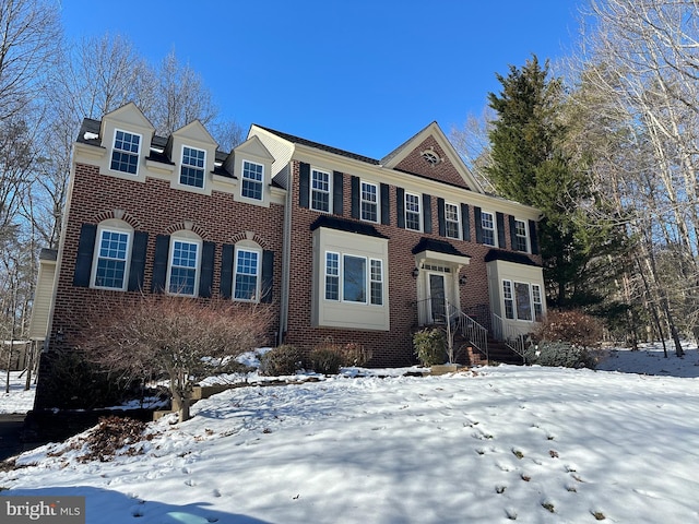 view of front of home featuring brick siding