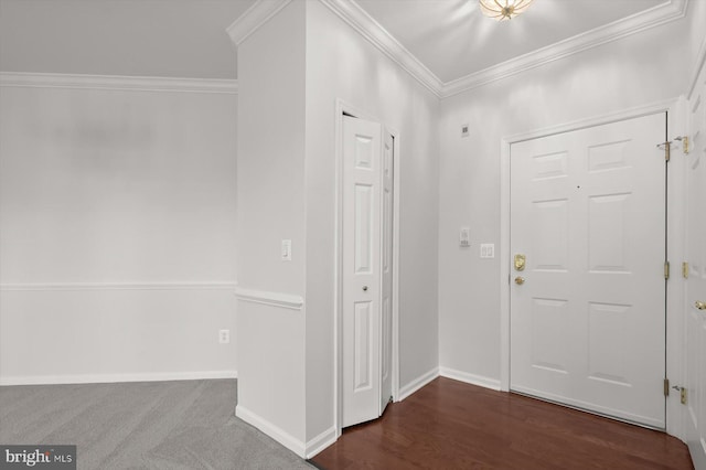 foyer entrance featuring dark wood-type flooring and ornamental molding