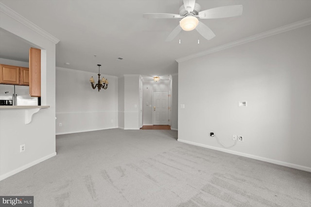 unfurnished living room with crown molding, ceiling fan with notable chandelier, and light carpet