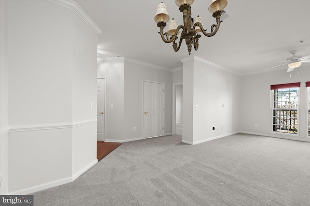 carpeted spare room with ceiling fan with notable chandelier and ornamental molding