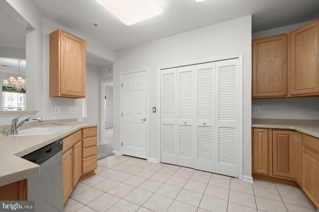 kitchen with sink, light tile patterned floors, a chandelier, and dishwasher